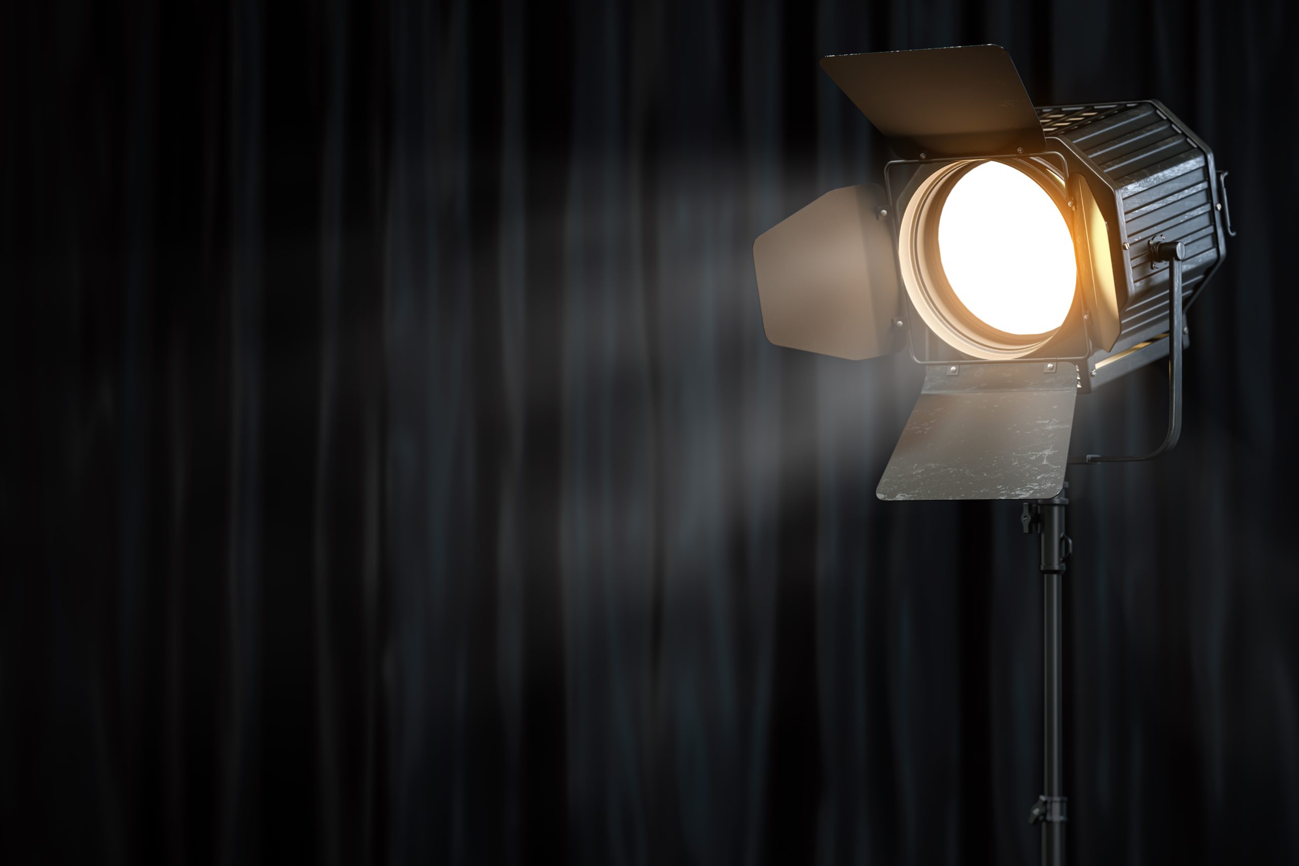 Stage or studio spotlight on black curtain background. Lighting equipment for Studio photography or videography. 3d illustration