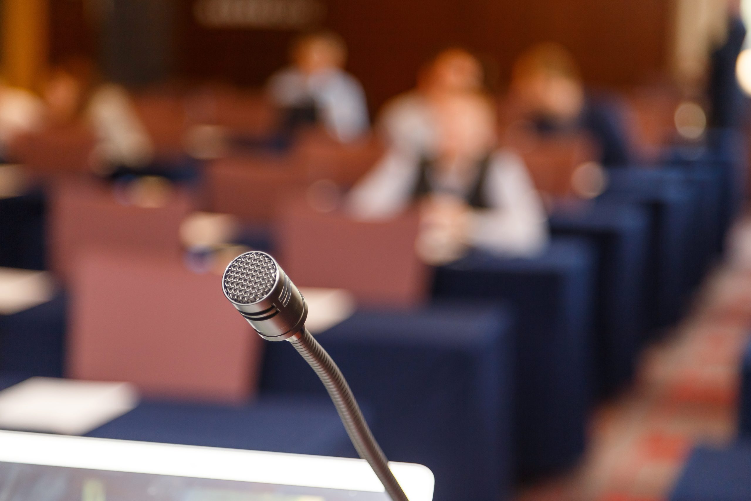 Microphone over conference hall background, Business meeting concept.