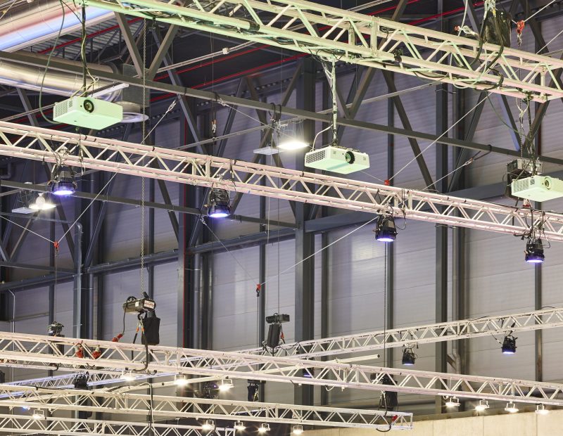 Lighting and projectors truss structure indoor set. Exhibition hall. Show